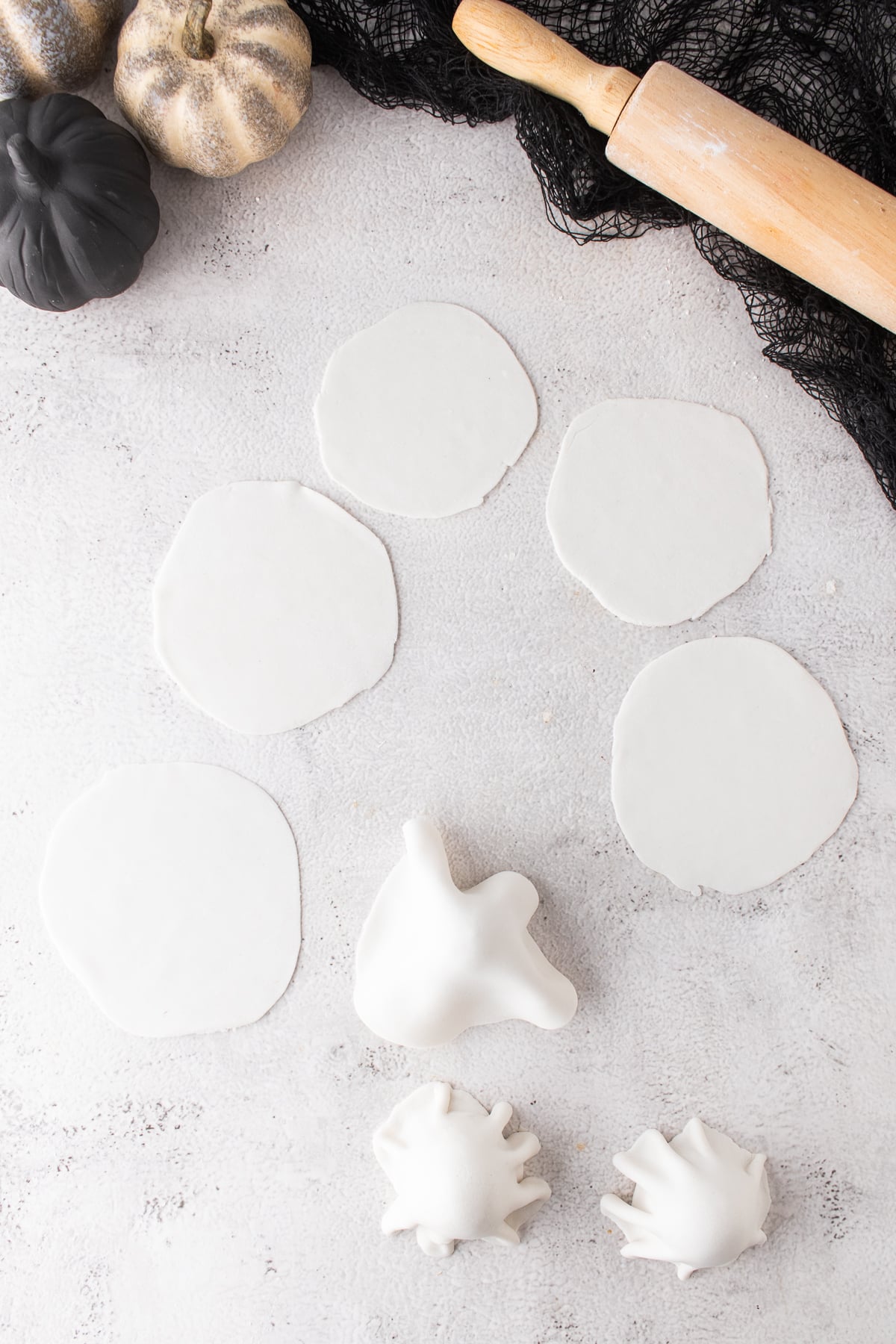 White fondant draped over an Oreo truffle to create a ghost cloak.