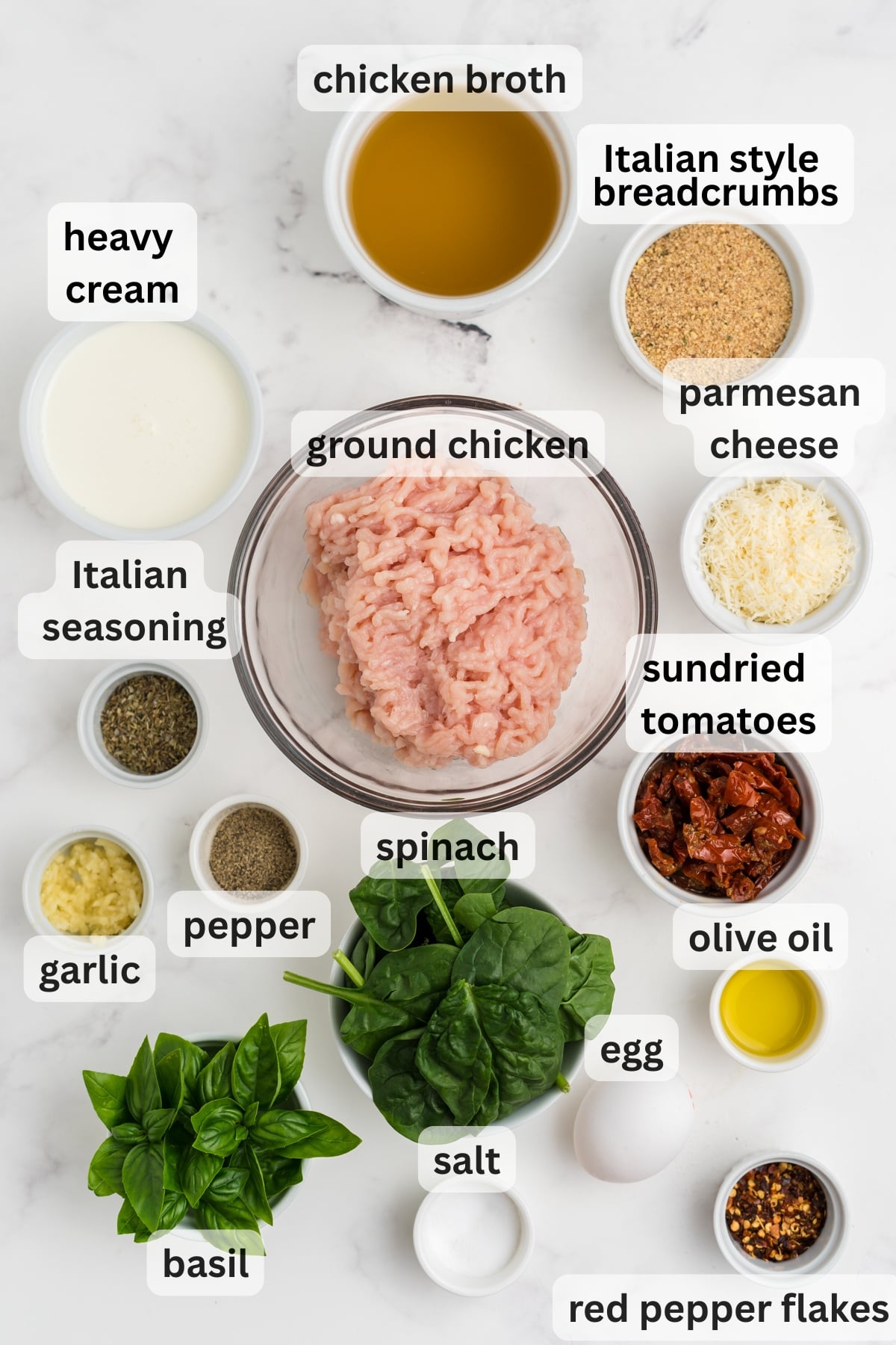 All of the ingredients needed to make Marry Me Chicken Meatballs in bowls on a table.