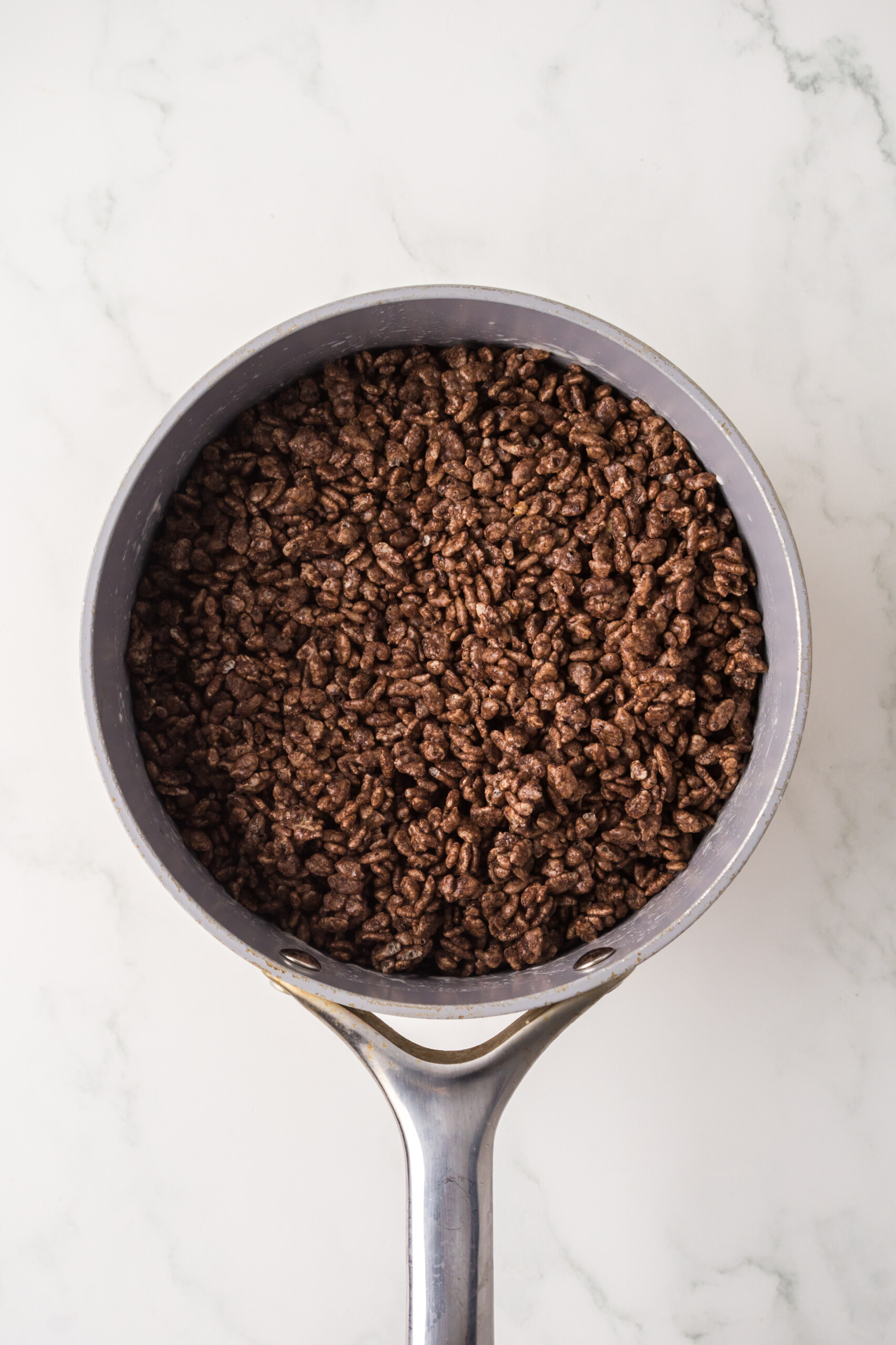 Rice Krispie mixture in a saucepan.