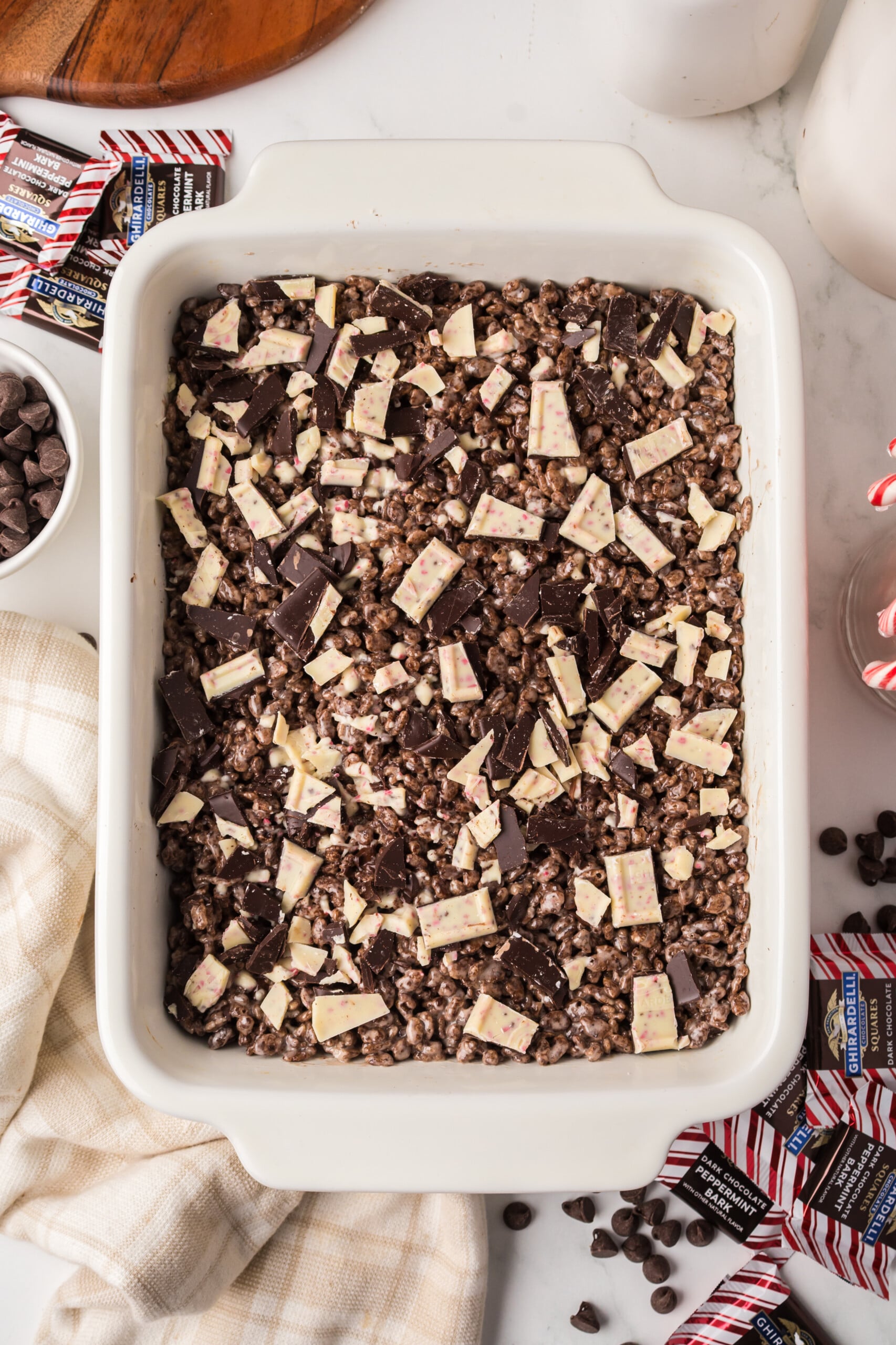 Rice Krispie mixture pressed in dish sprinkled with chopped peppermint bark.