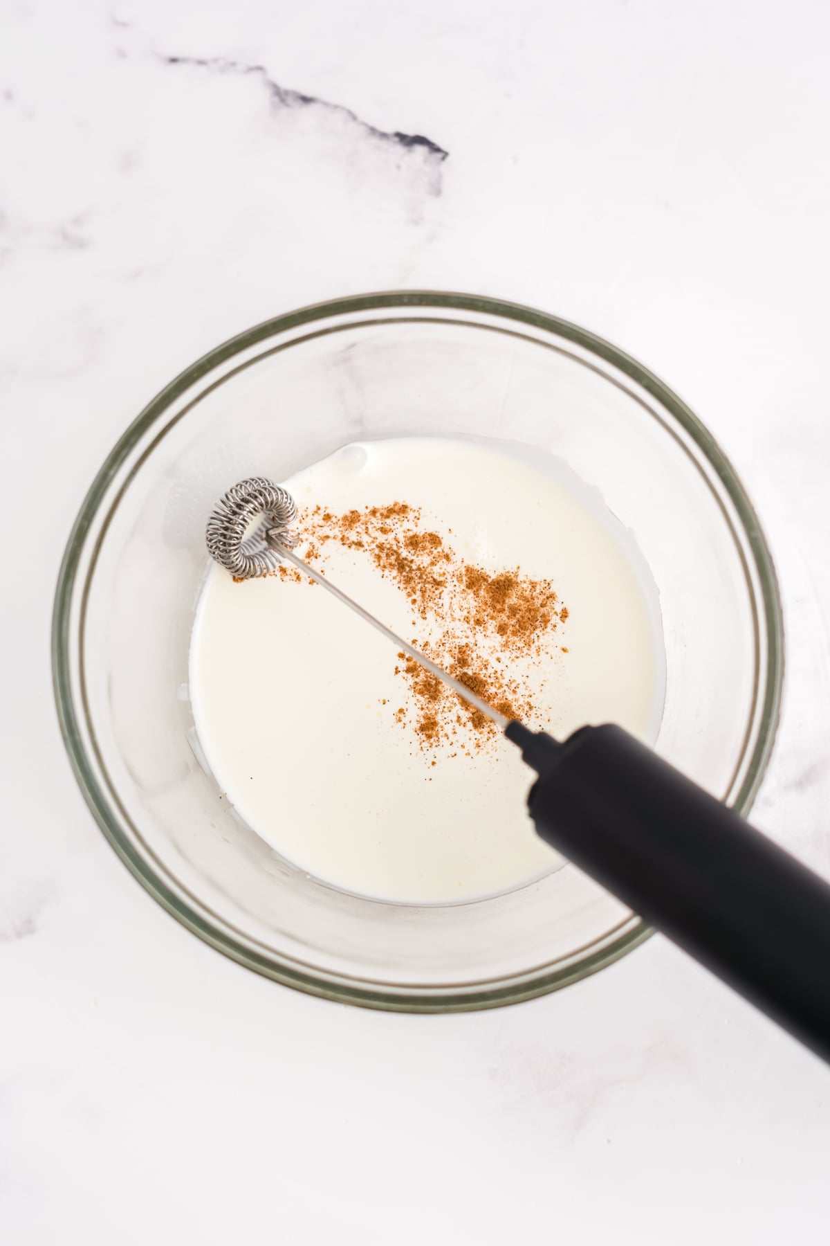 Frother turning ingredients into cold foam.