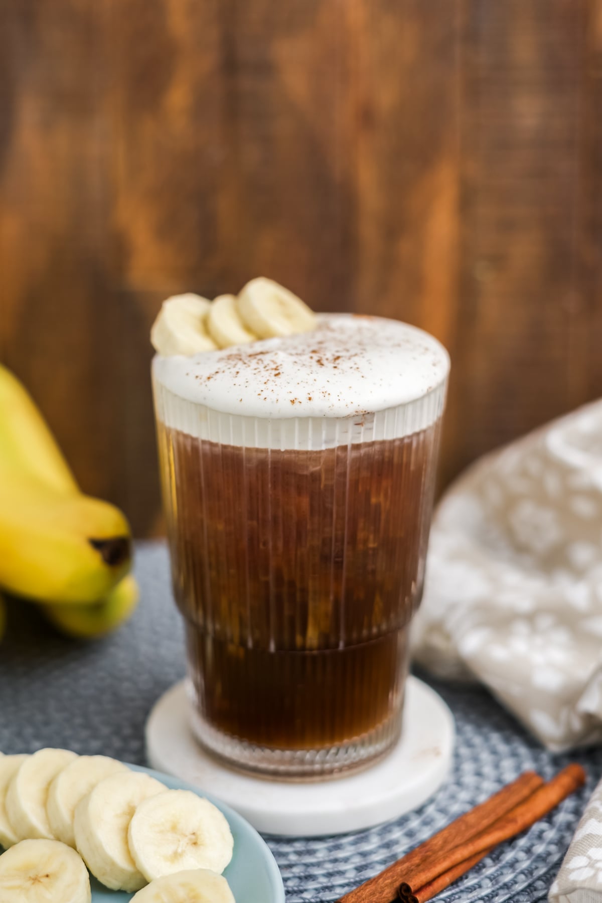 Cold foam topped on a cold coffee with a sprinkling of cinnamon.