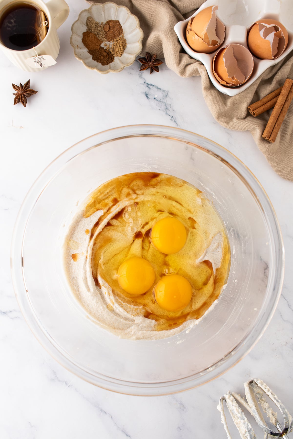 Butter, oil, and sugar creamed together in a mixing bowl with eggs and vanilla.