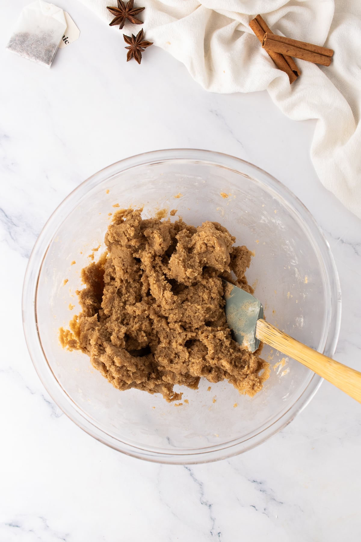 Completed cookie dough in a bowl with a spatula.