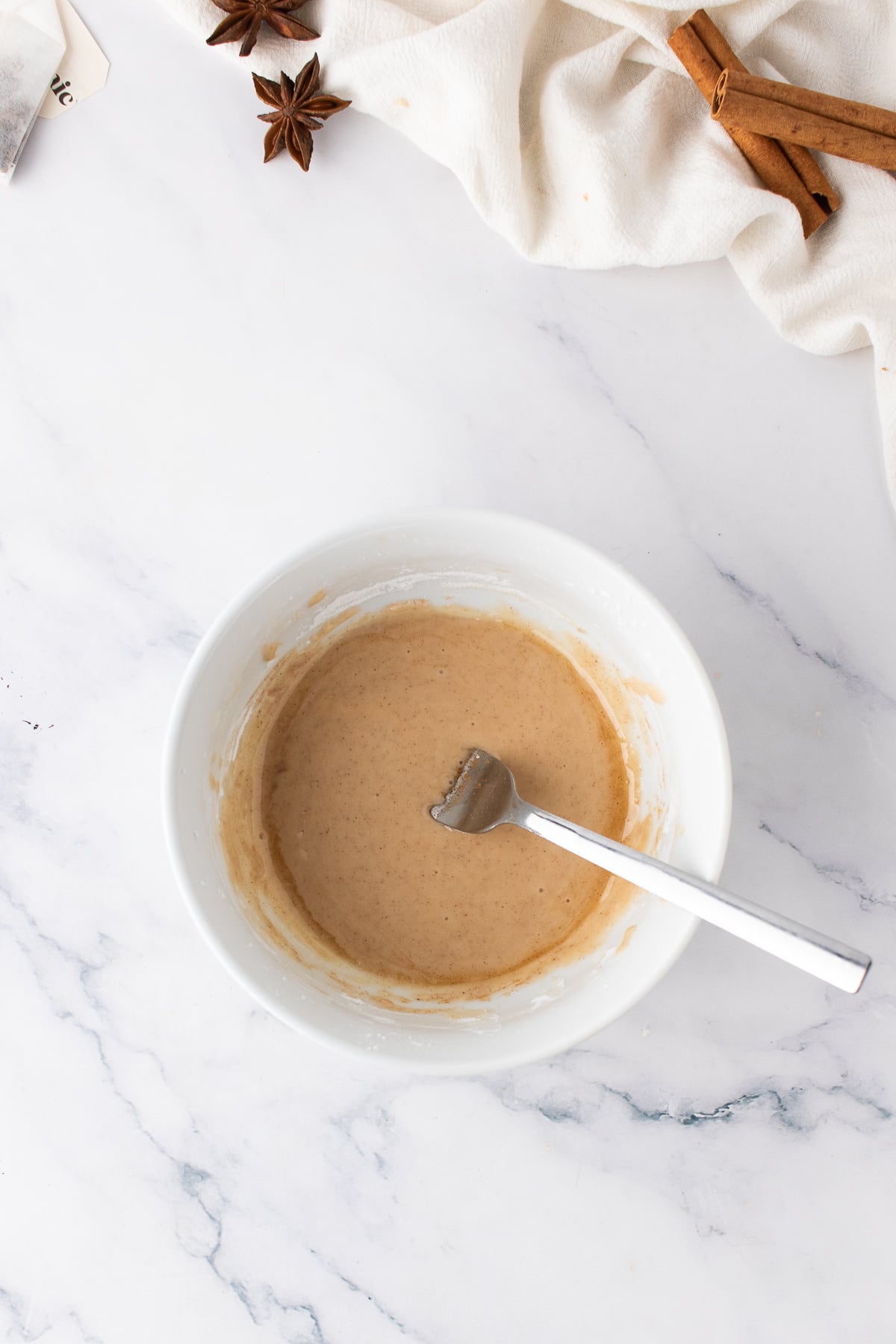 Chai glaze in a bowl with a fork.