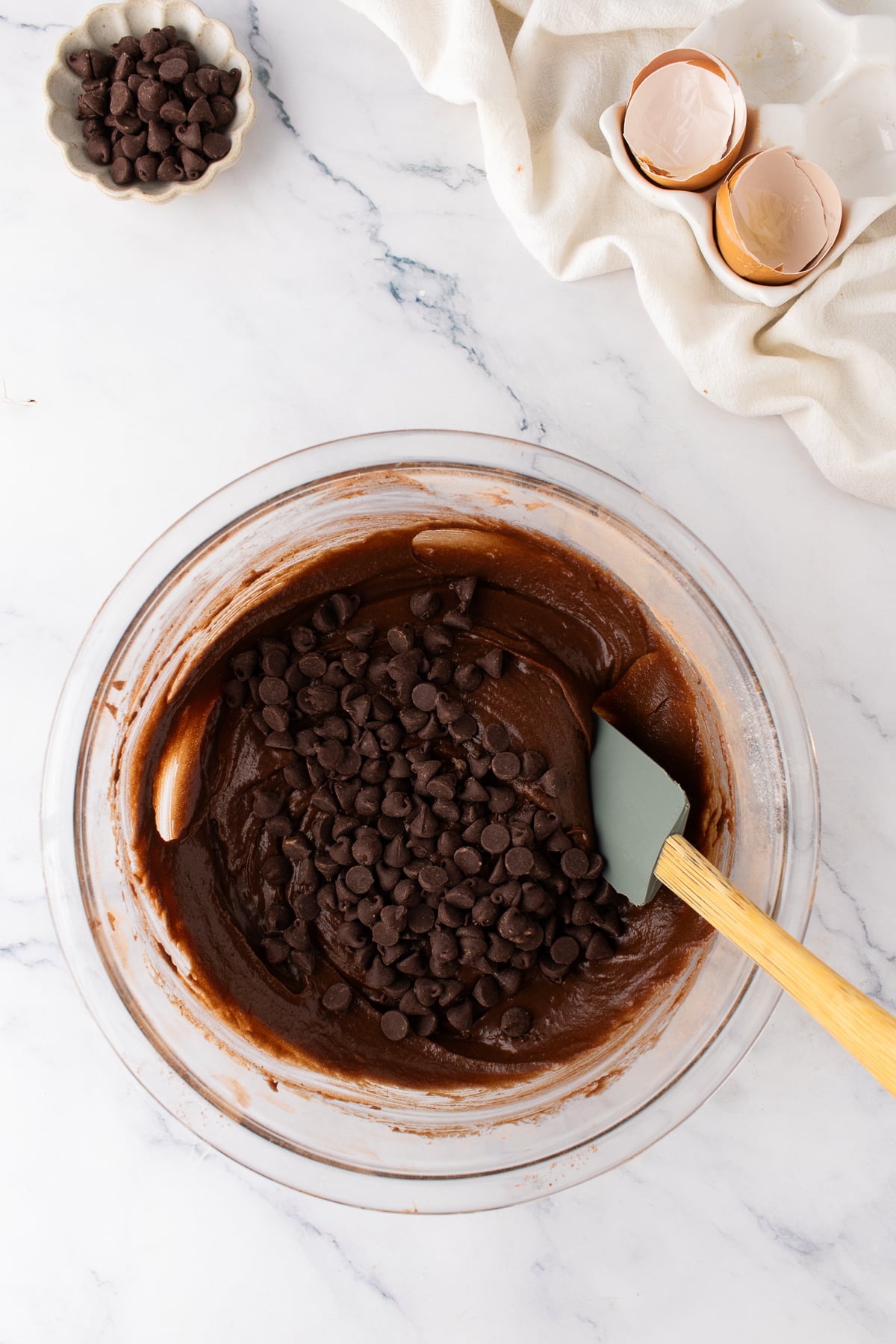 Chocolate brownie batter mixed with semi-sweet chocolate chips