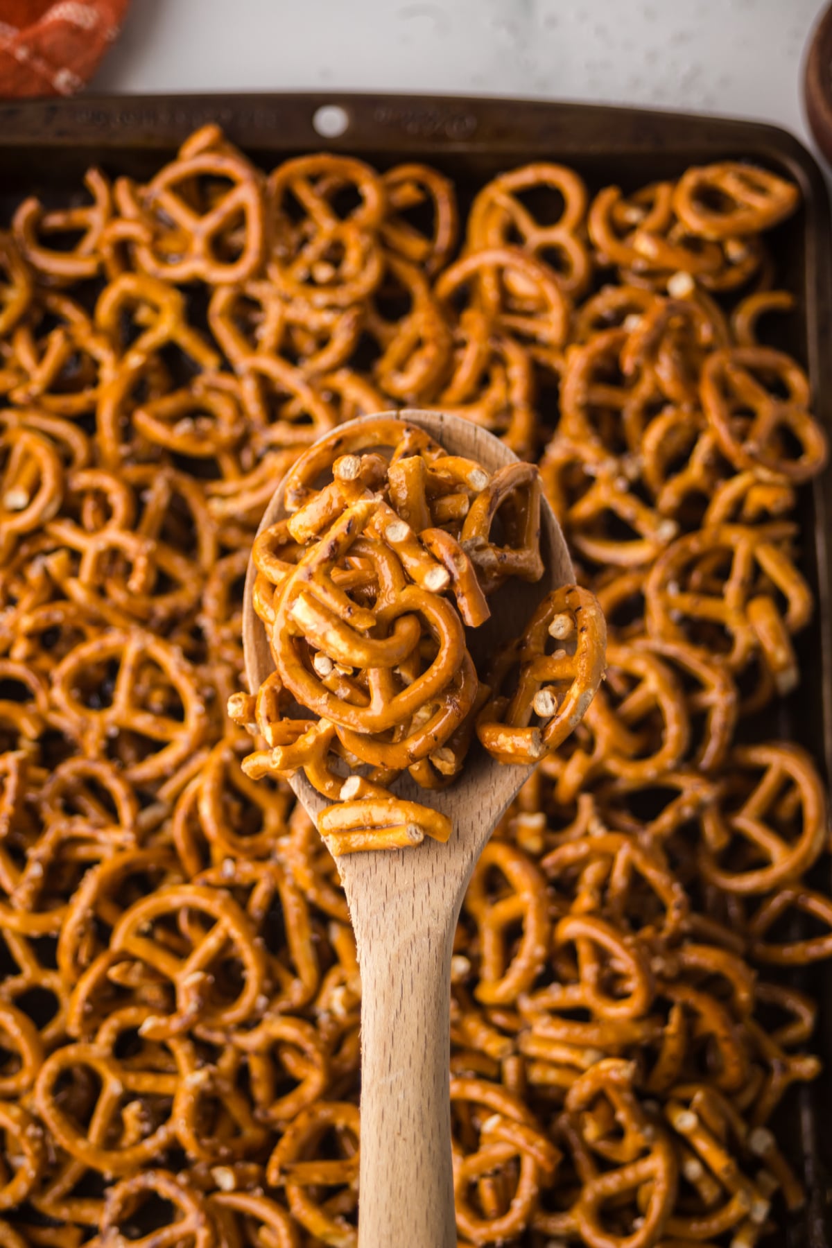 Baked pretzels being stirred to separate the clusters