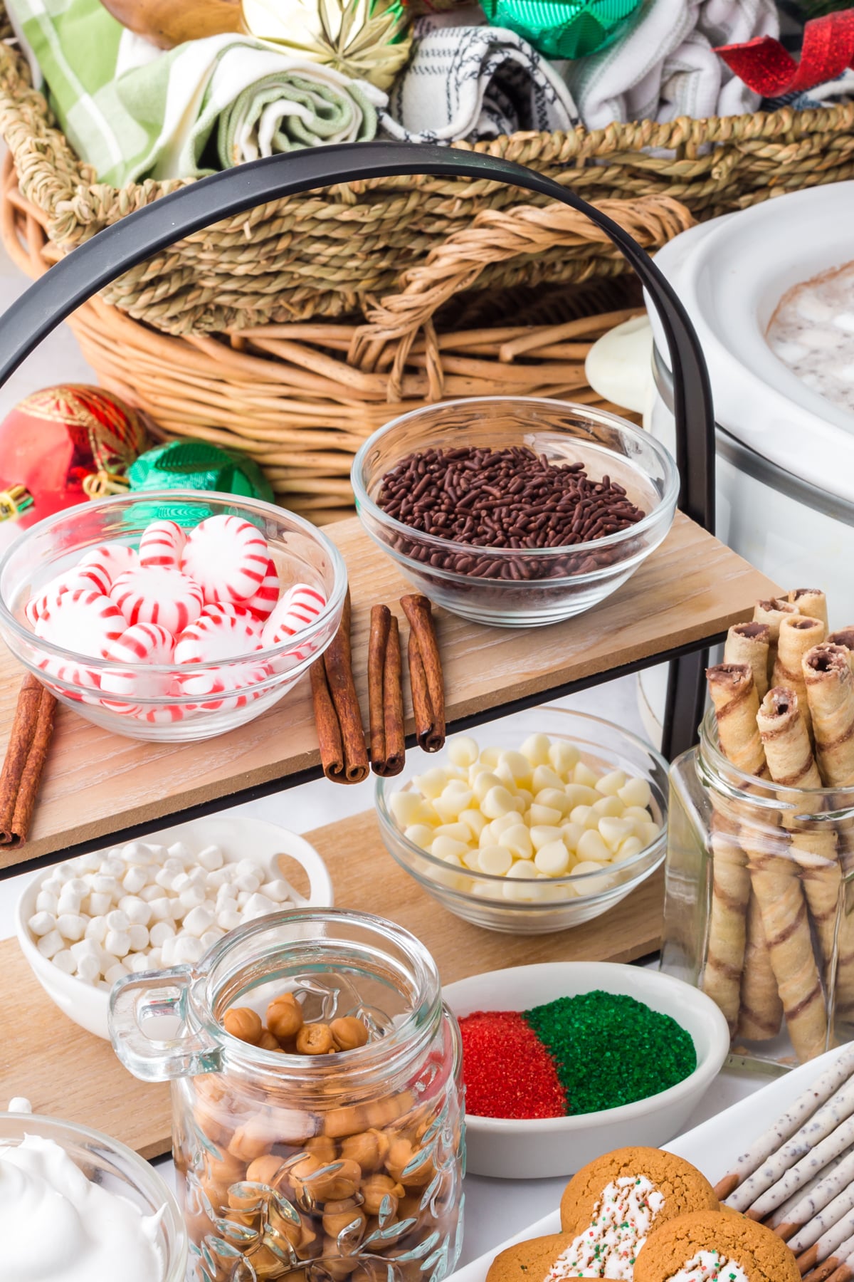 The toppings in bowls on display on a table.