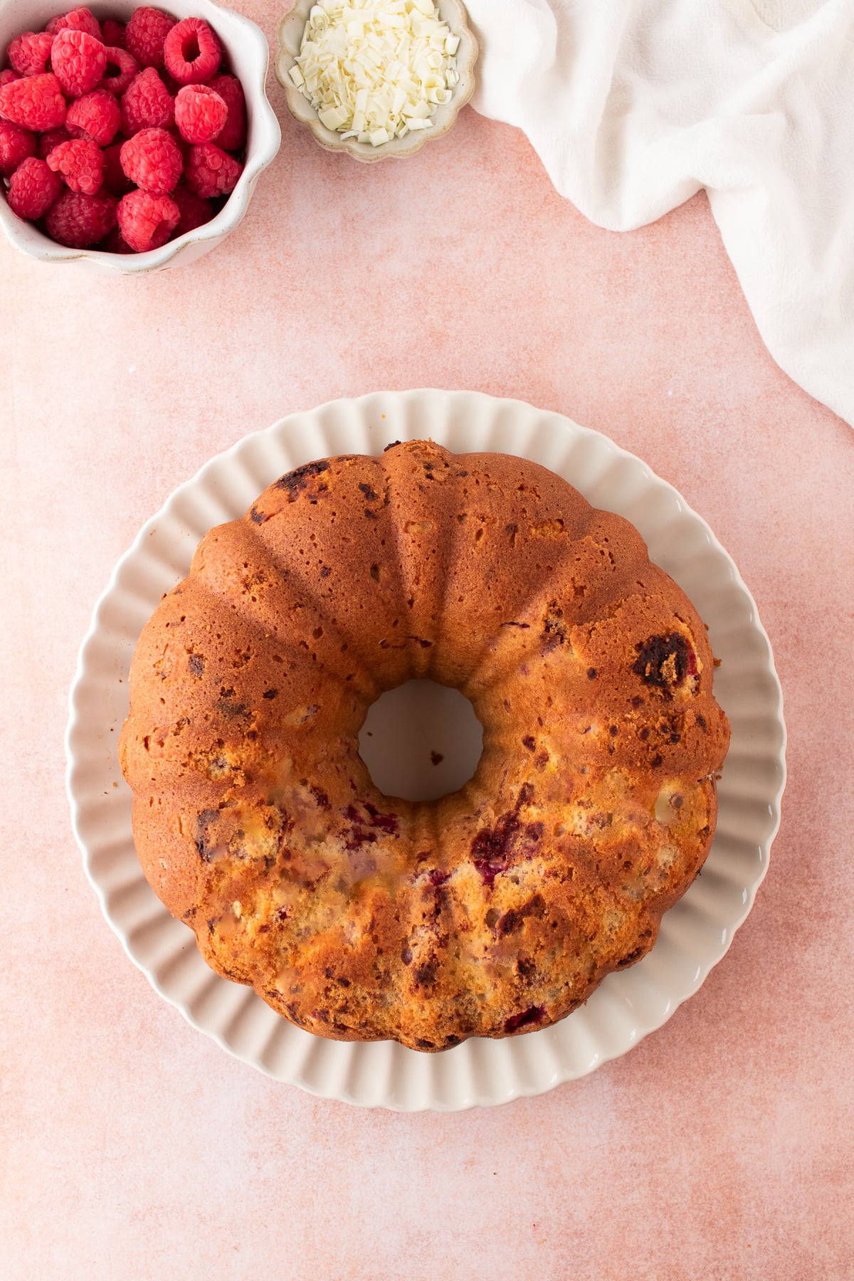 Baked raspberry Bundt cake inverted onto a wire rack to cool.