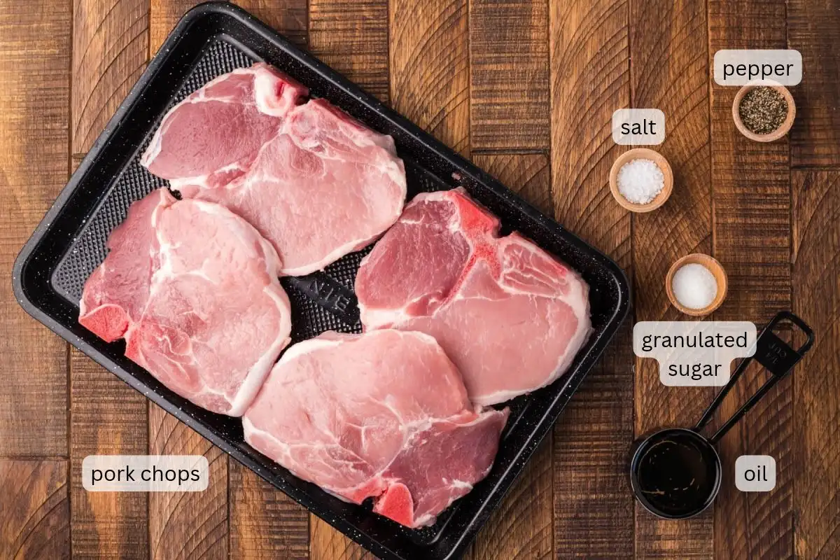 Ingredients to make pan fried pork chops without flour on the counter.