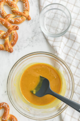 honey and mustard mixed in a small mixing bowl. Salt and pepper added to taste.