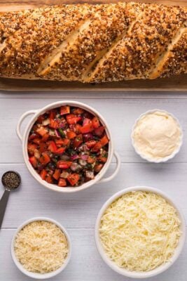 Overhead photo of all the ingredients needed to make cheese bruschetta bites.